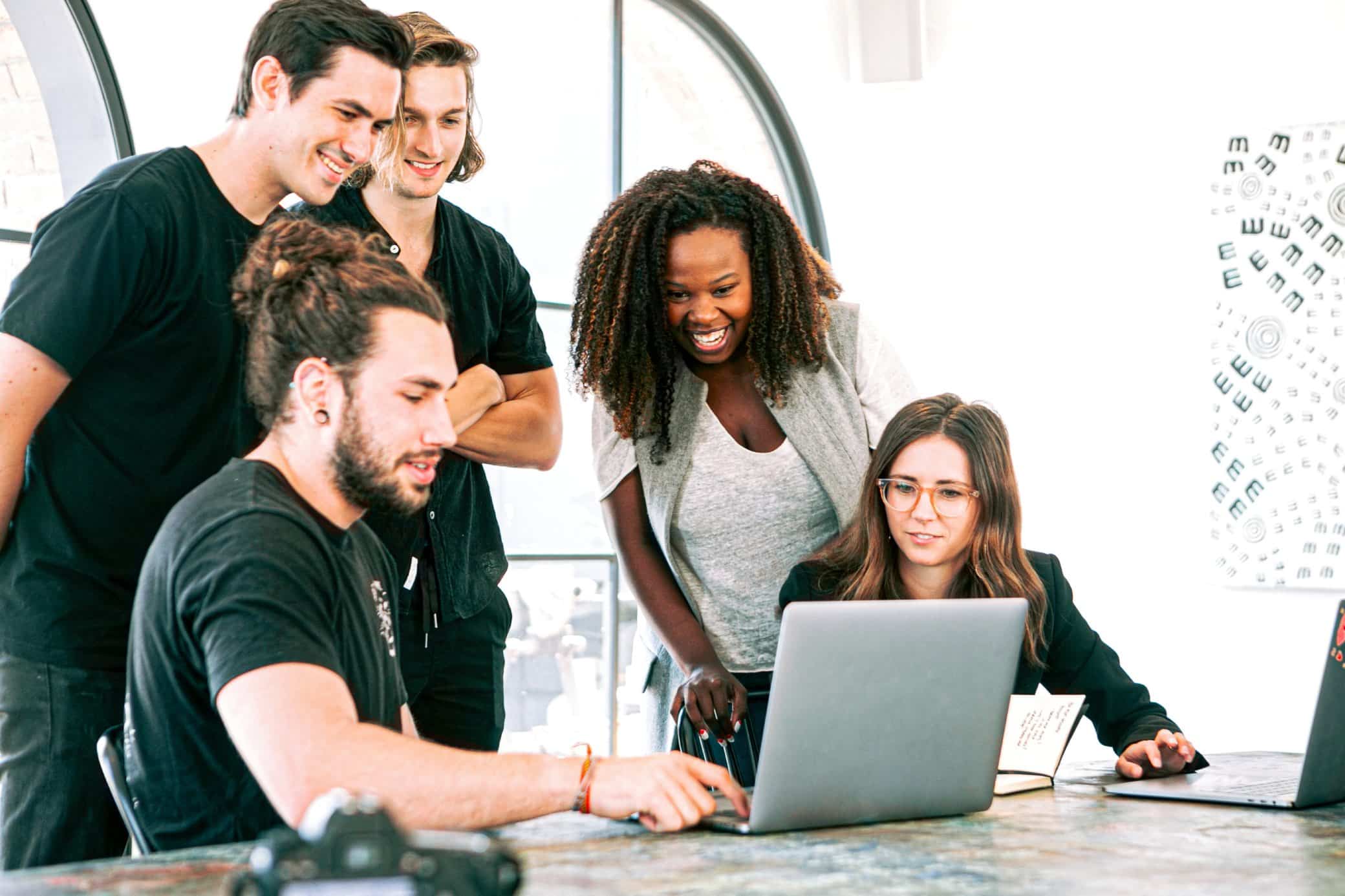 people working together around a computer