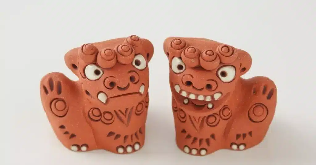 Handcrafted clay figurines with expressive faces, representing the creativity and cultural influence behind unique product development and product innovation.