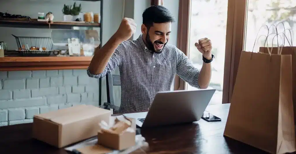 Go-to-market strategy Etsy success shown by a seller celebrating their first online sales.