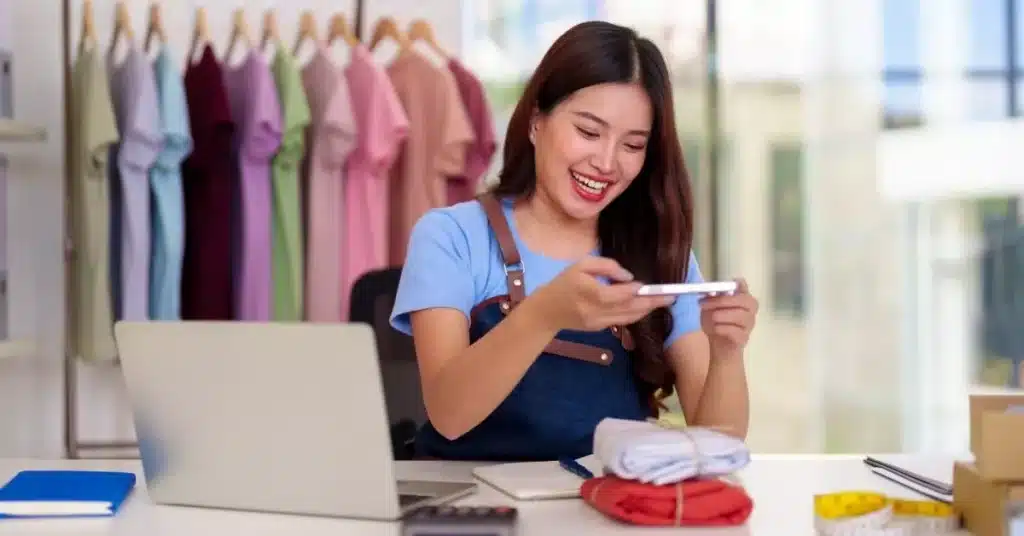 Go-to-market strategy Etsy example featuring a new seller photographing products for an Etsy shop.