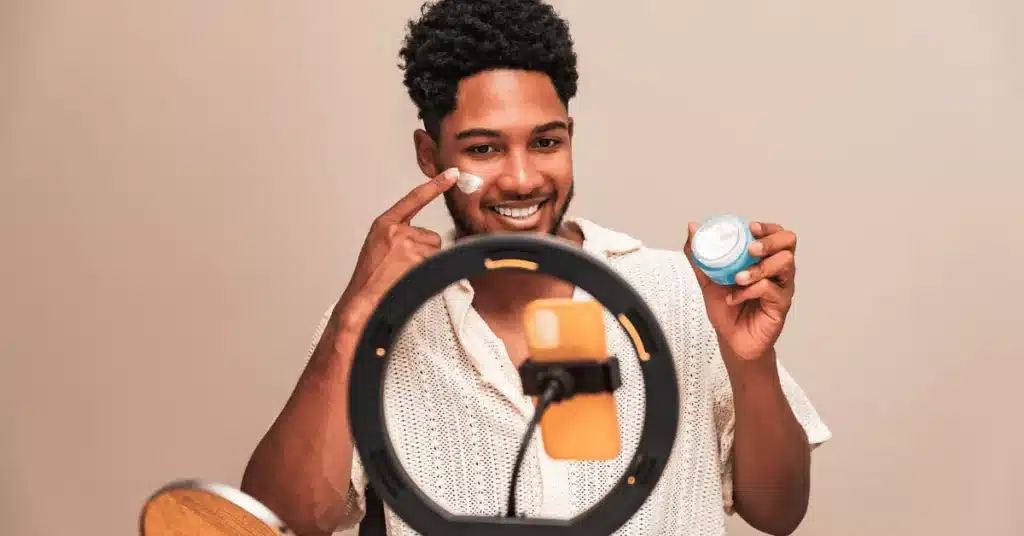 TikTok influencer marketing product demonstration with a creator reviewing skincare items on camera for brand partnerships
